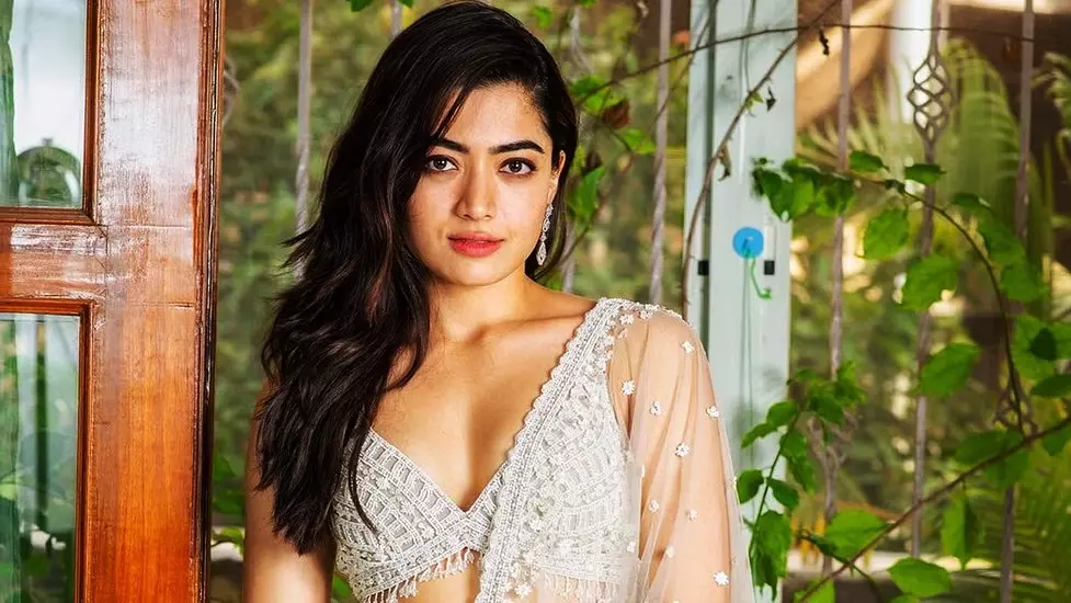 Stunned Rashmika’s blushing pleases all, as her assistant touches her feet at his wedding