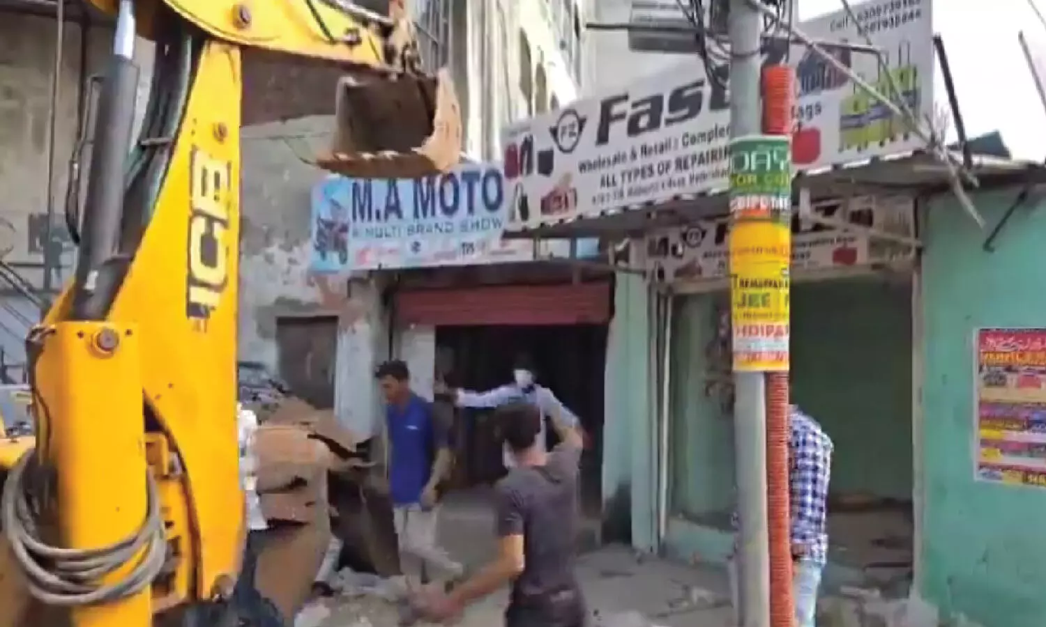 GHMC demolishes six shops for road expansion in Mallepally